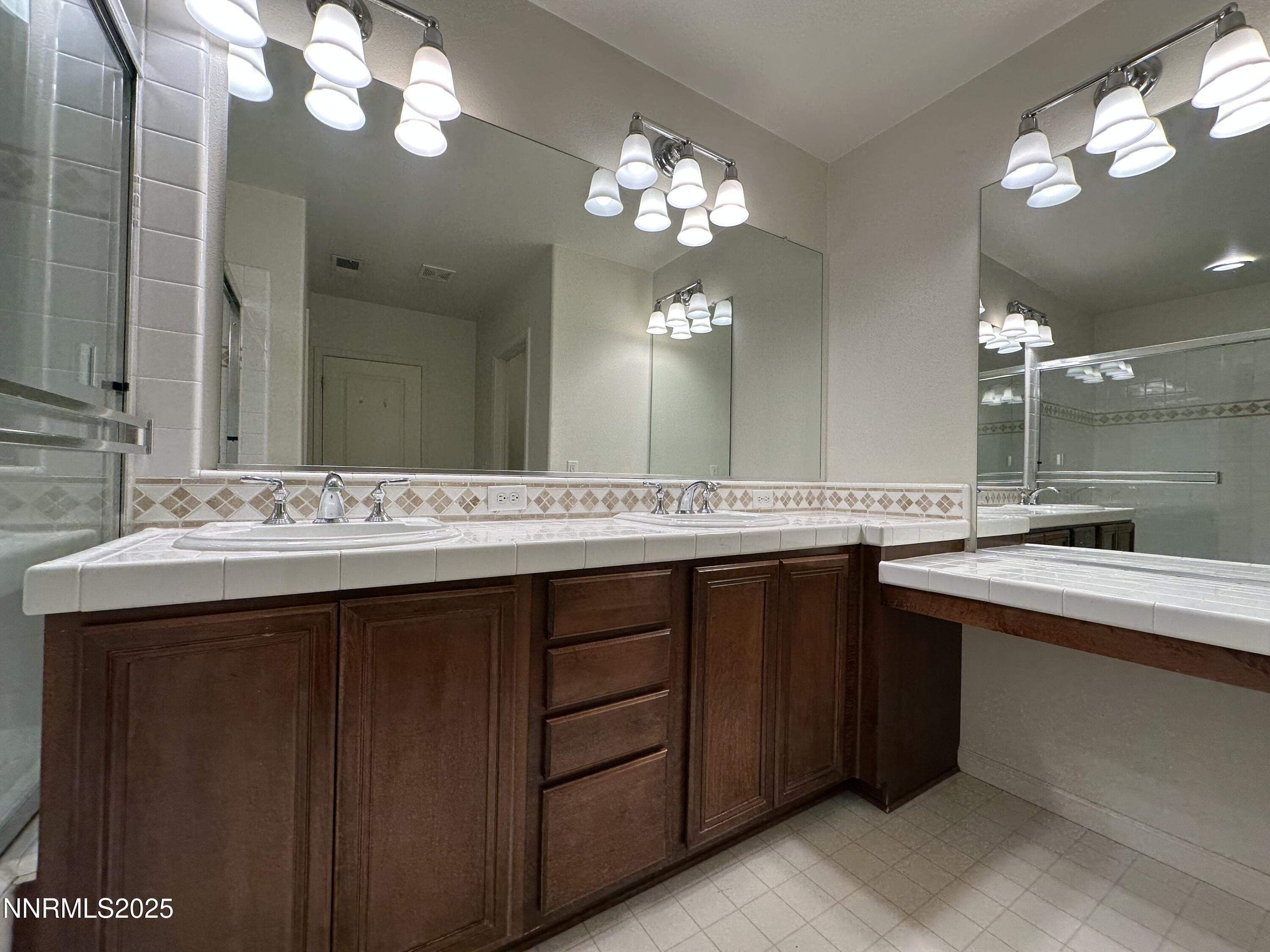 1625 Clover Hill Trail Reno, NV 89523 - Photo 20 of 41 a bathroom with a sink and a mirror