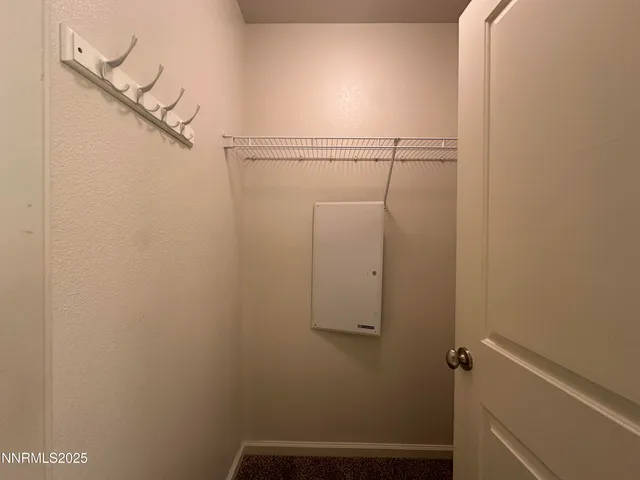 a view of small space with racks on the wall