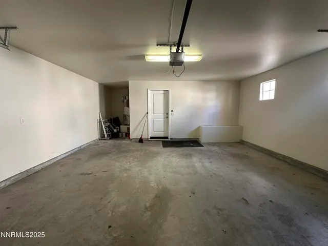 a view of storage and utility room with wooden floor