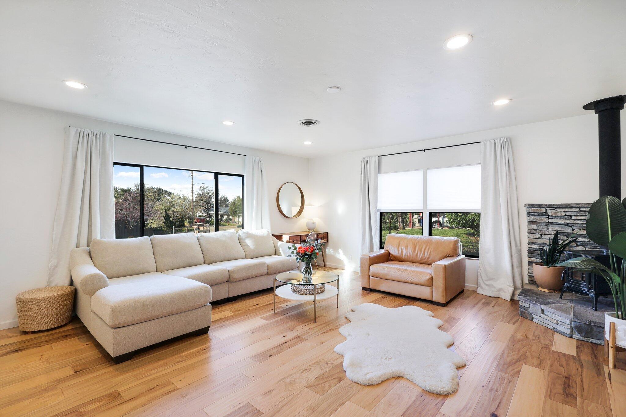 1750 Barbara Road Redding, CA 96003 - Photo 1 of 21 a living room with furniture and a large window