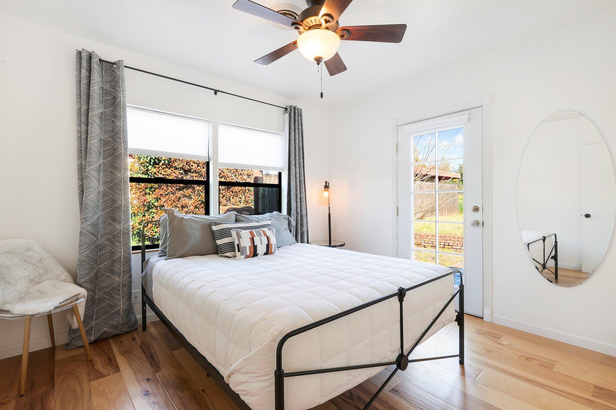 1750 Barbara Road Redding, CA 96003 - Photo 14 of 21 a bedroom with a bed and a window