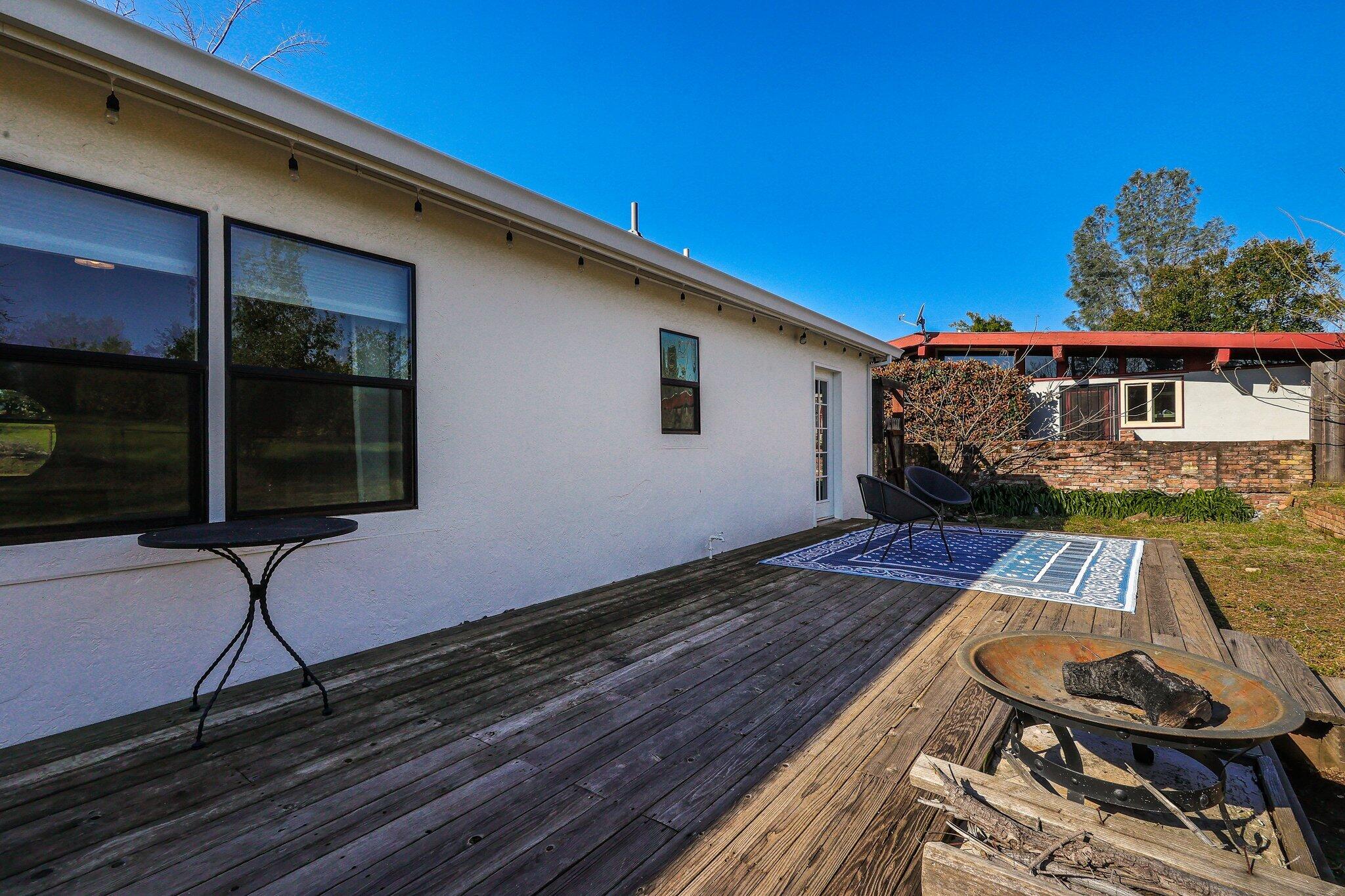 1750 Barbara Road Redding, CA 96003 - Photo 15 of 21 a balcony with wooden floor table and chairs