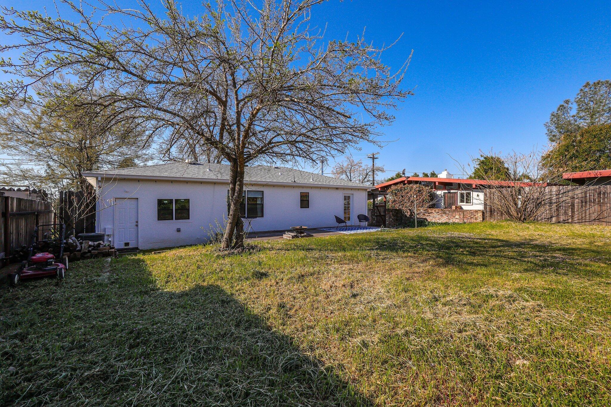 1750 Barbara Road Redding, CA 96003 - Photo 17 of 21 a front view of a house with garden