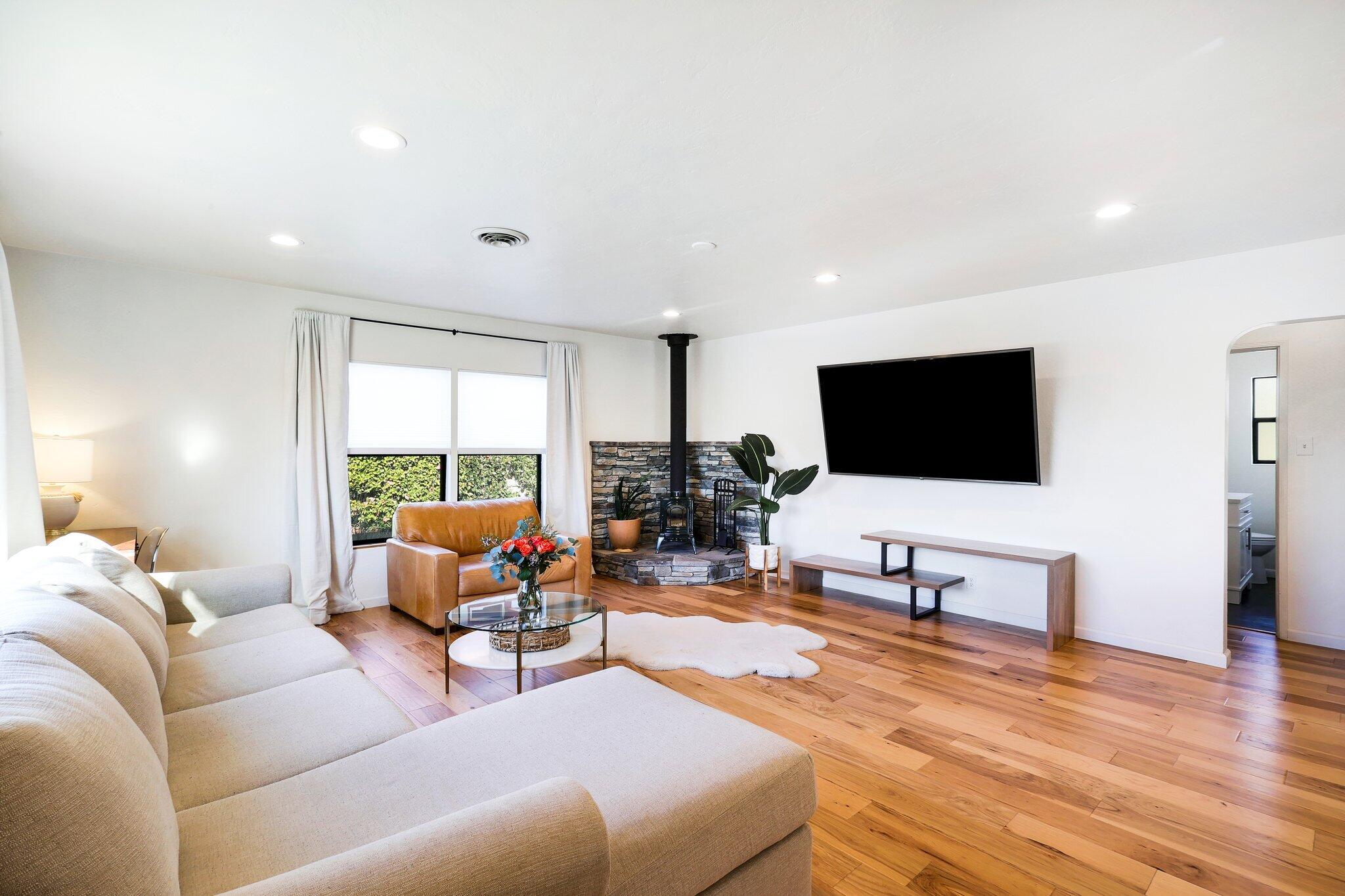 1750 Barbara Road Redding, CA 96003 - Photo 4 of 21 a living room with furniture and a flat screen tv