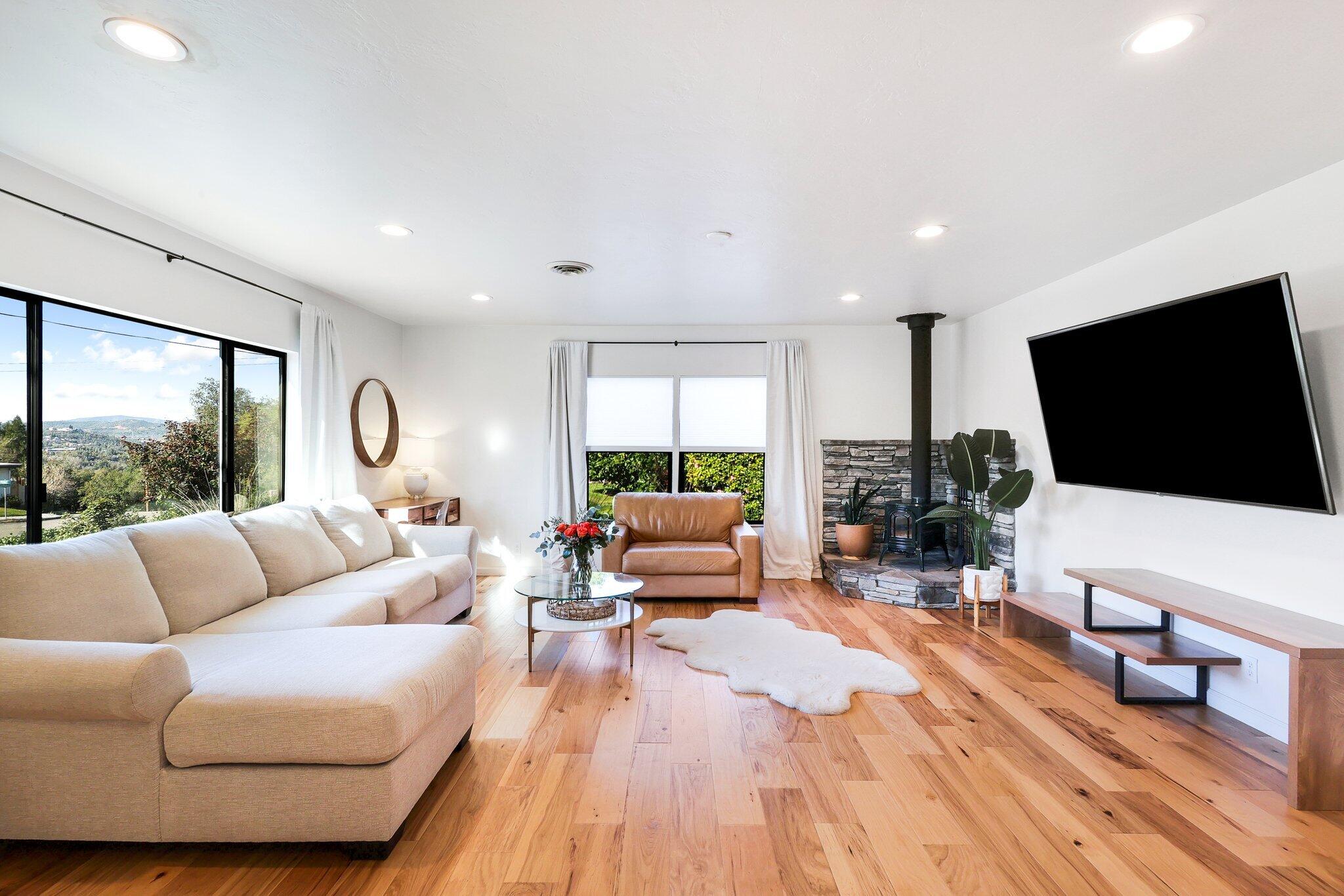 1750 Barbara Road Redding, CA 96003 - Photo 7 of 21 a living room with furniture and a flat screen tv