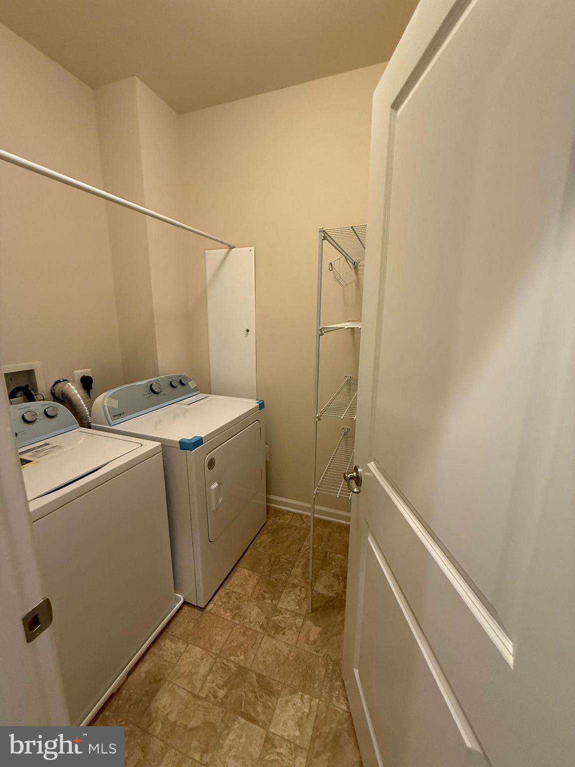 202 B Mill Pond Road Frederick, MD 21701 - Photo 43 of 44 a utility room with dryer and washer