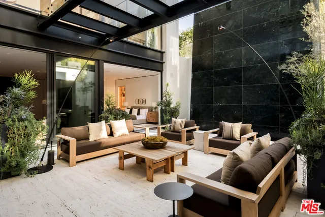 a swimming pool with view of lake and trees in the background