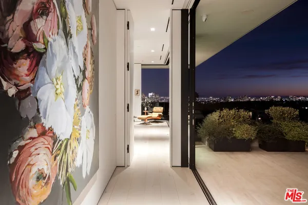 a view of a terrace with couches and city view