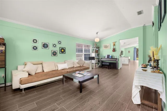 a open kitchen with stainless steel appliances granite countertop a refrigerator and a stove top oven