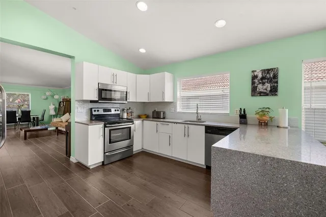 a bedroom with bed and a window