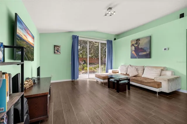 an aerial view of lake and residential houses with outdoor space