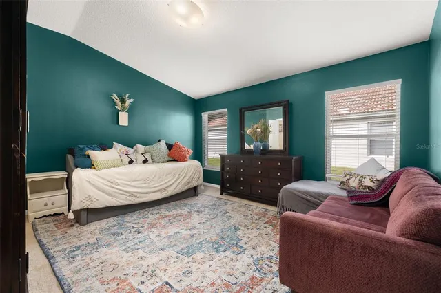 a view of a lake with a house in the background