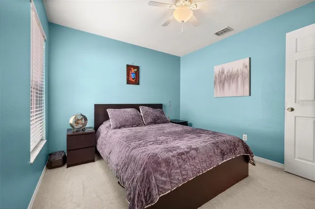 a view of a storage & utility room with dryer and washer
