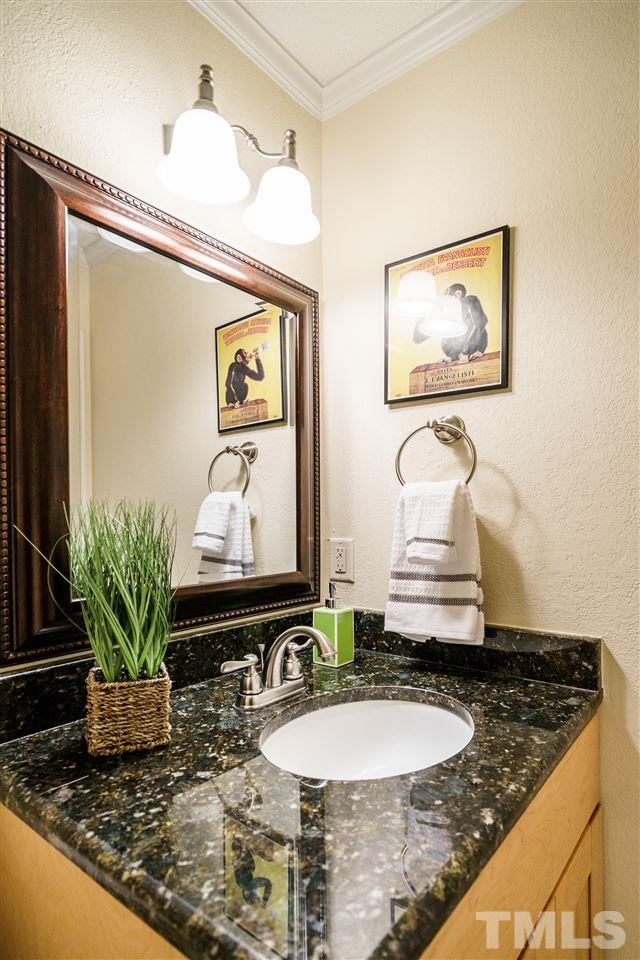 5532 Hamstead Crossing Raleigh, NC 27612 - Photo 12 of 25 a bathroom with a granite countertop sink and a mirror