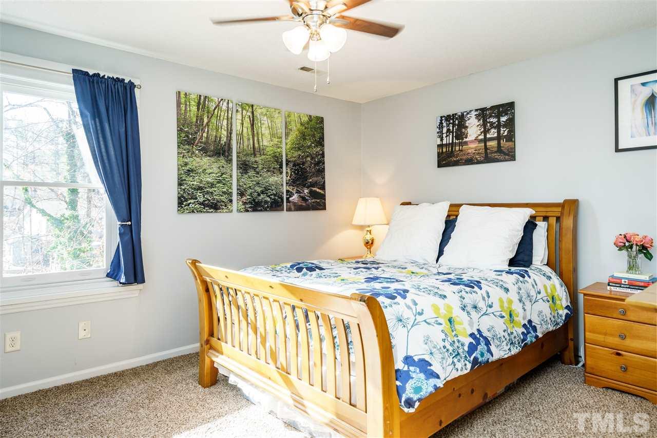 5532 Hamstead Crossing Raleigh, NC 27612 - Photo 13 of 25 a bedroom with a bed and a window