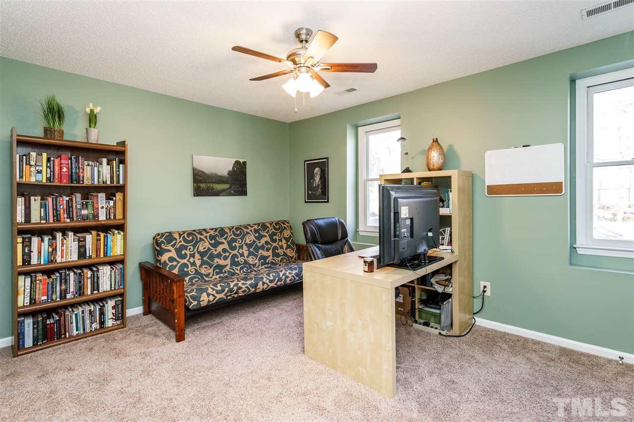 5532 Hamstead Crossing Raleigh, NC 27612 - Photo 16 of 25 a living room with furniture workspace and a window