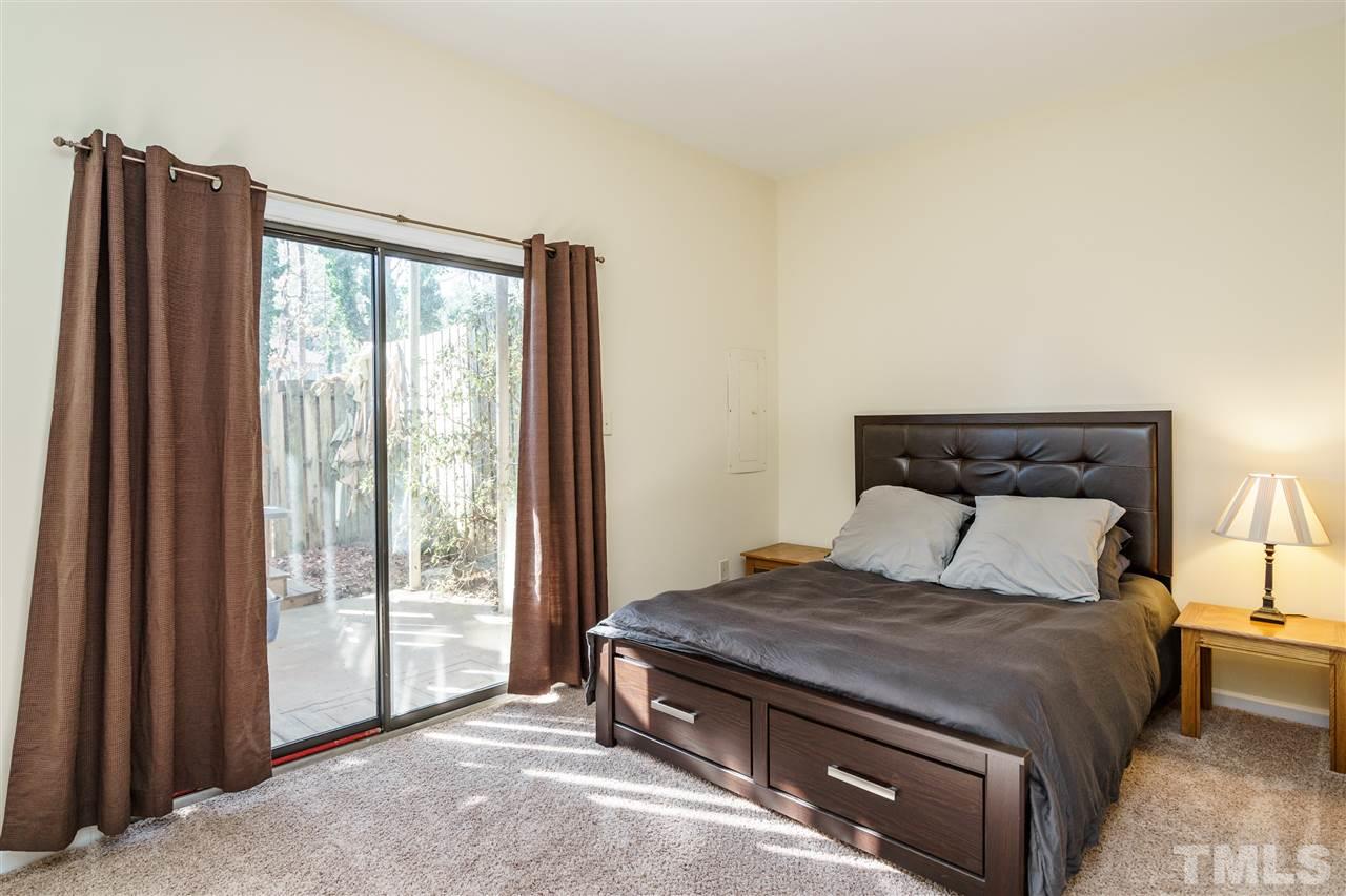 5532 Hamstead Crossing Raleigh, NC 27612 - Photo 18 of 25 a bedroom with a bed and wooden floor
