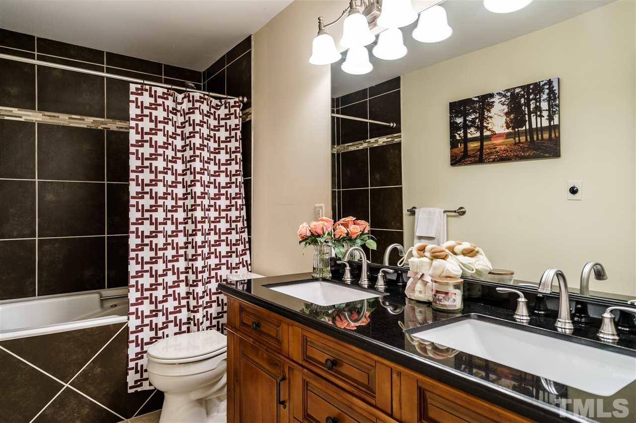 5532 Hamstead Crossing Raleigh, NC 27612 - Photo 20 of 25 a bathroom with a sink toilet and shower