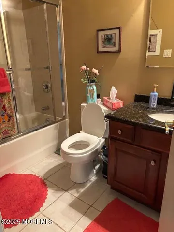 a bathroom with a toilet a sink and a shower