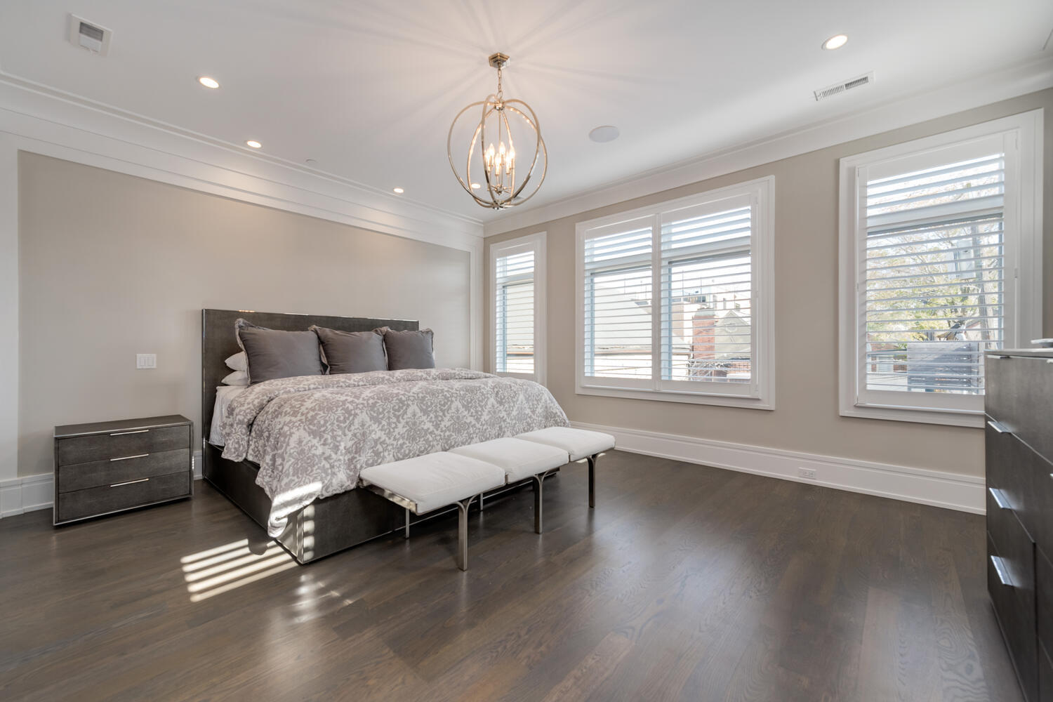 1823 North Bissell Street Chicago, IL 60614 - Photo 25 of 56 a bedroom with a bed and a chandelier