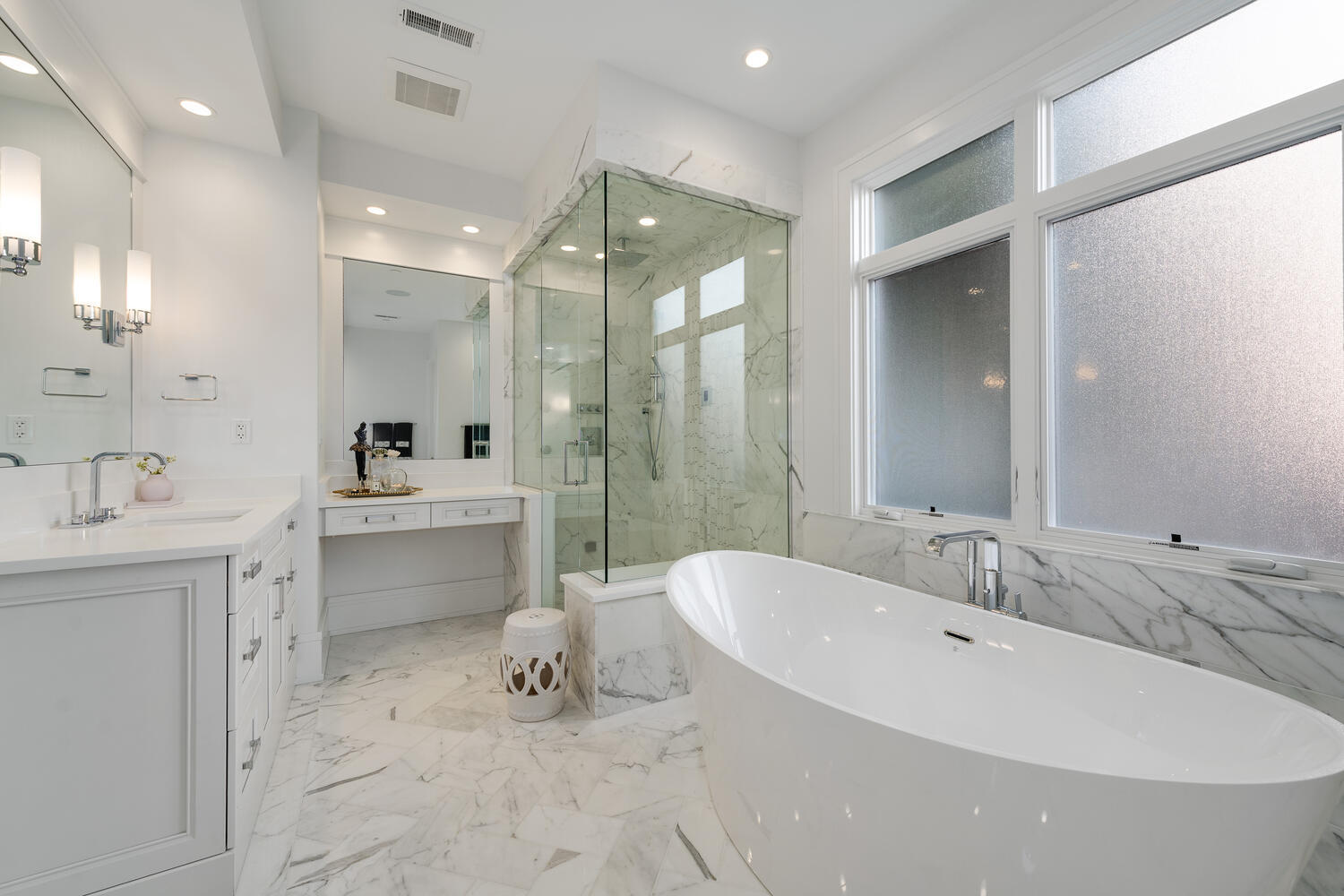 1823 North Bissell Street Chicago, IL 60614 - Photo 28 of 56 a large bathroom with a double vanity sink a toilet a mirror and shower