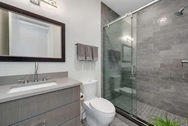 a view of a kitchen with white cabinets