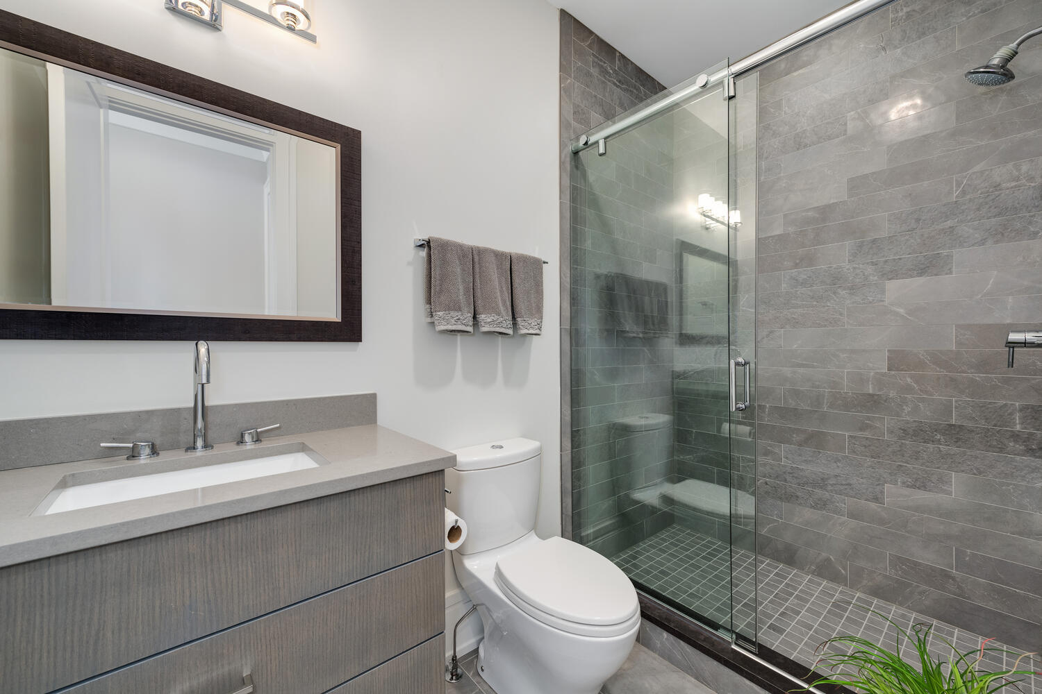 1823 North Bissell Street Chicago, IL 60614 - Photo 36 of 56 a bathroom with a sink toilet a mirror and shower