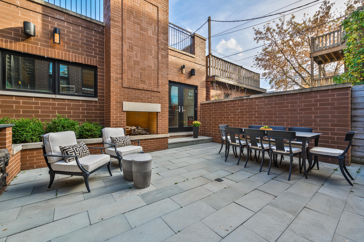 1823 North Bissell Street Chicago, IL 60614 - Photo 55 of 56 a view of a patio with dining table and chairs with wooden fence