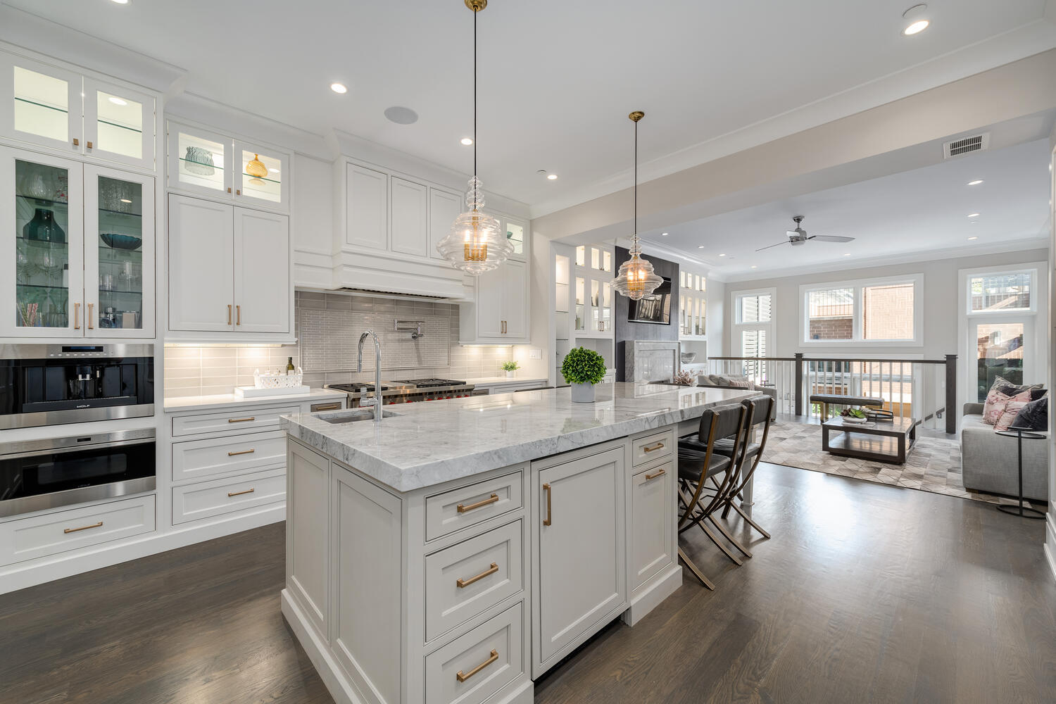 1823 North Bissell Street Chicago, IL 60614 - Photo 9 of 56 a kitchen with stainless steel appliances granite countertop a stove a refrigerator a kitchen island a sink and chairs