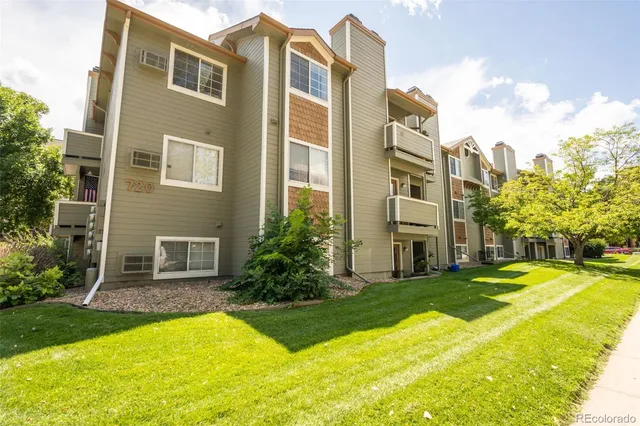a view of a house with yard and swimming pool