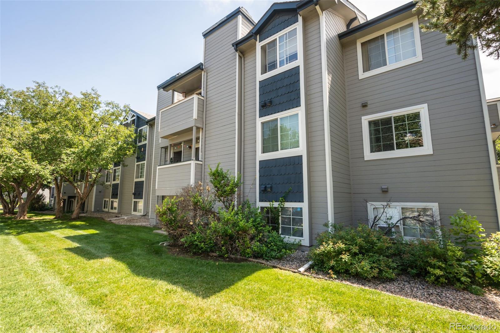 720 City Park Avenue, Unit C310 Fort Collins, CO 80521 - Photo 17 of 17 a view of a house with a yard and plants