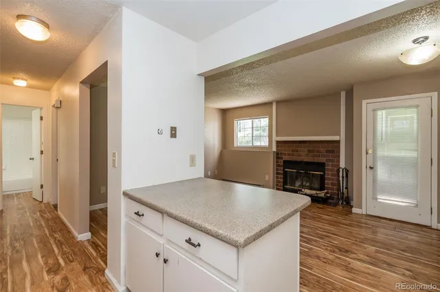 a kitchen with a stove and a refrigerator
