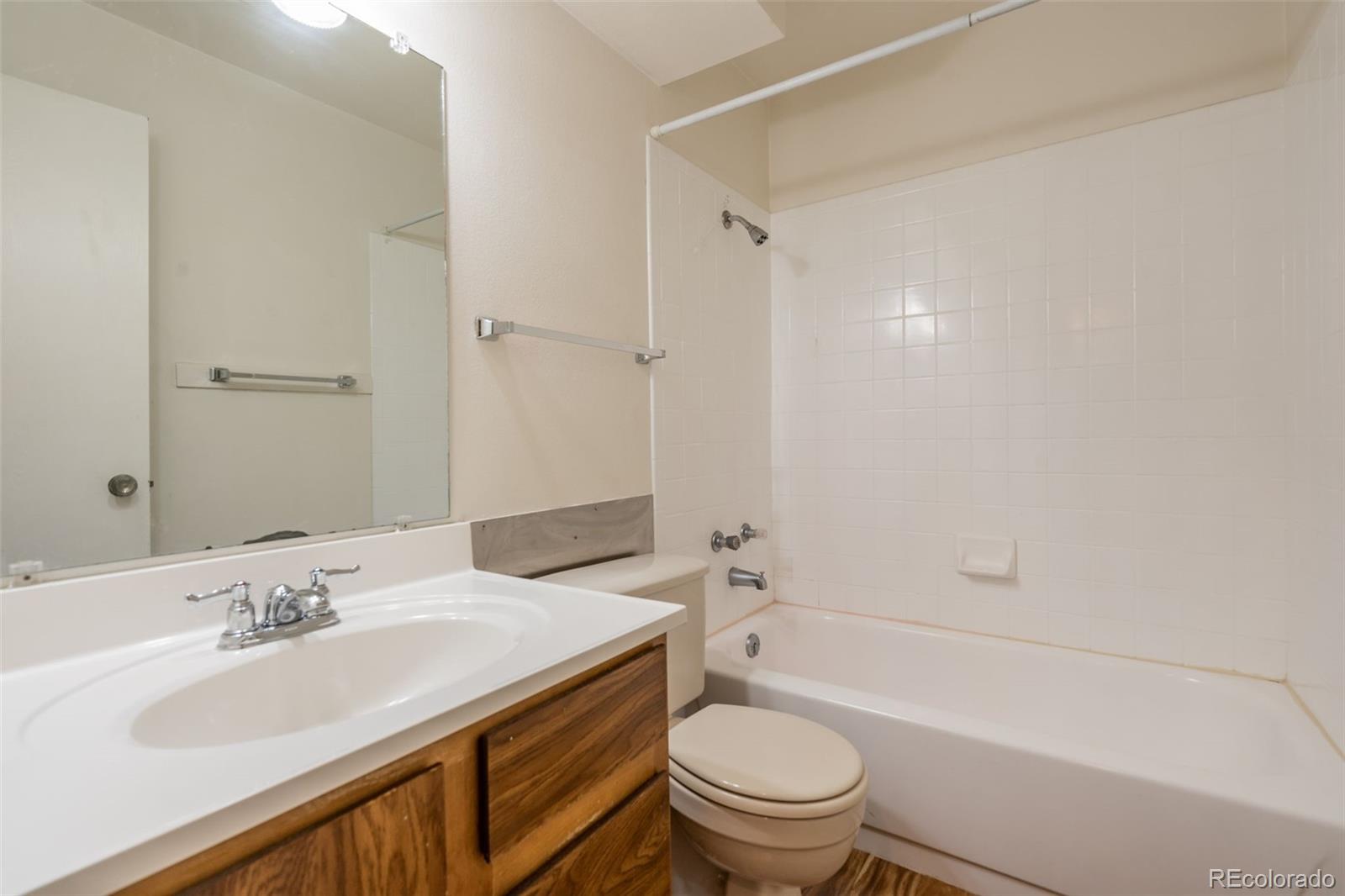 720 City Park Avenue, Unit C310 Fort Collins, CO 80521 - Photo 10 of 17 a bathroom with a sink toilet vanity and shower
