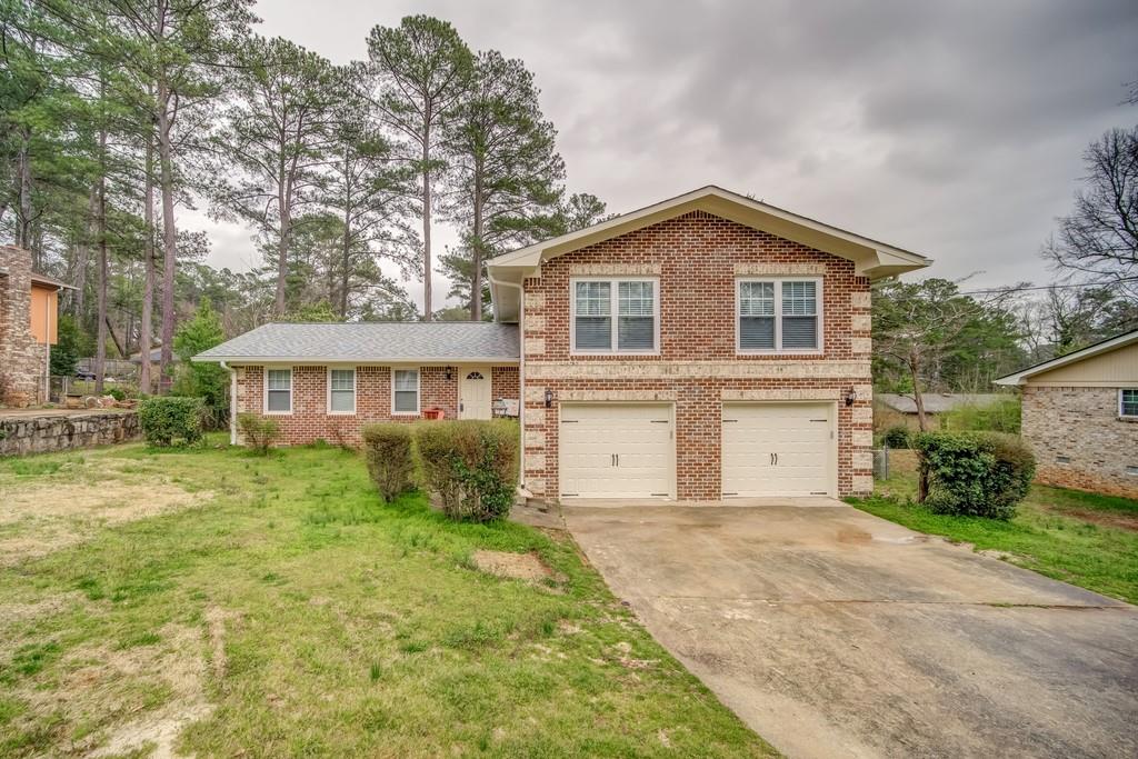 3634 Radcliffe Boulevard Decatur, GA 30034 - Photo 1 of 1 a front view of a house with garden