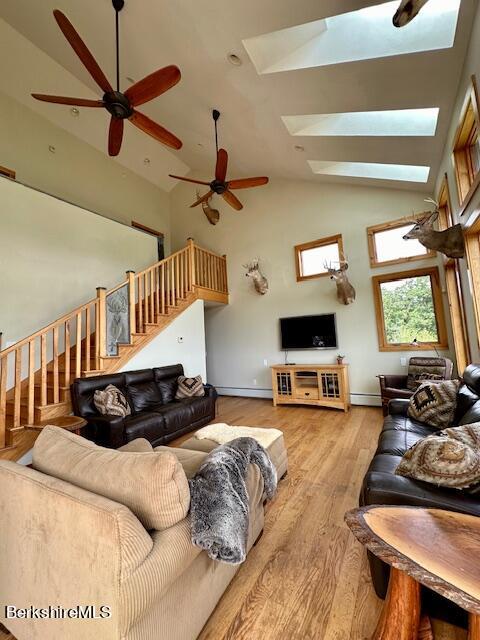 26 A Stonebridge Way Tyringham, MA 01238 - Photo 19 of 74 a living room with furniture ceiling fan and a window