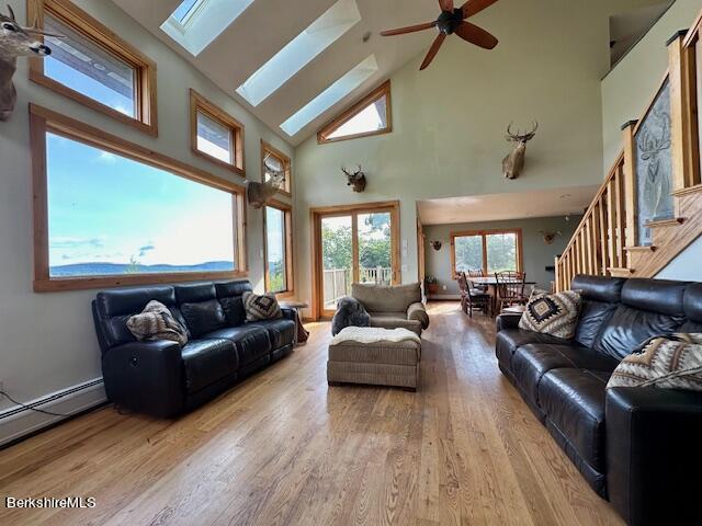 26 A Stonebridge Way Tyringham, MA 01238 - Photo 20 of 74 a living room with furniture and a large window