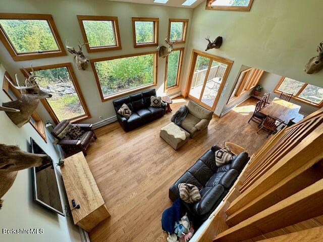 26 A Stonebridge Way Tyringham, MA 01238 - Photo 21 of 74 a view of a living room with furniture and a floor to ceiling window