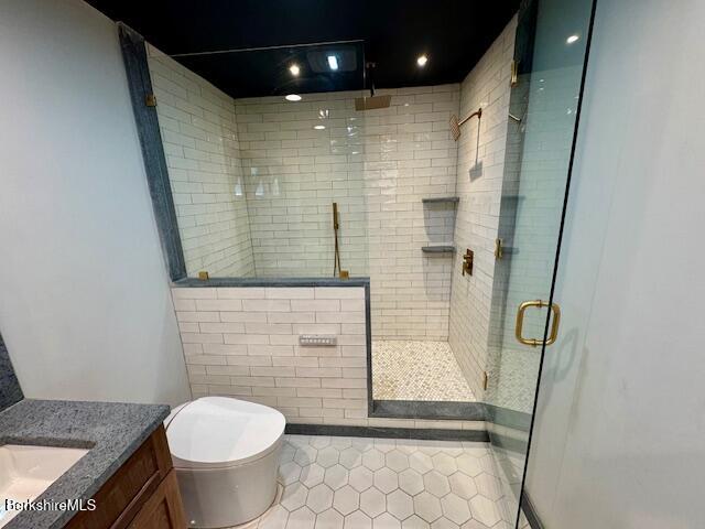 26 A Stonebridge Way Tyringham, MA 01238 - Photo 28 of 74 a bathroom with a granite countertop sink toilet and shower