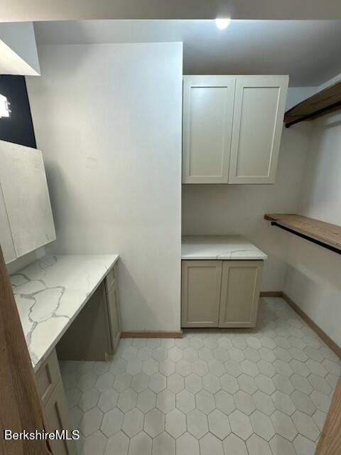 26 A Stonebridge Way Tyringham, MA 01238 - Photo 31 of 74 a utility room with a sink a toilet and a mirror