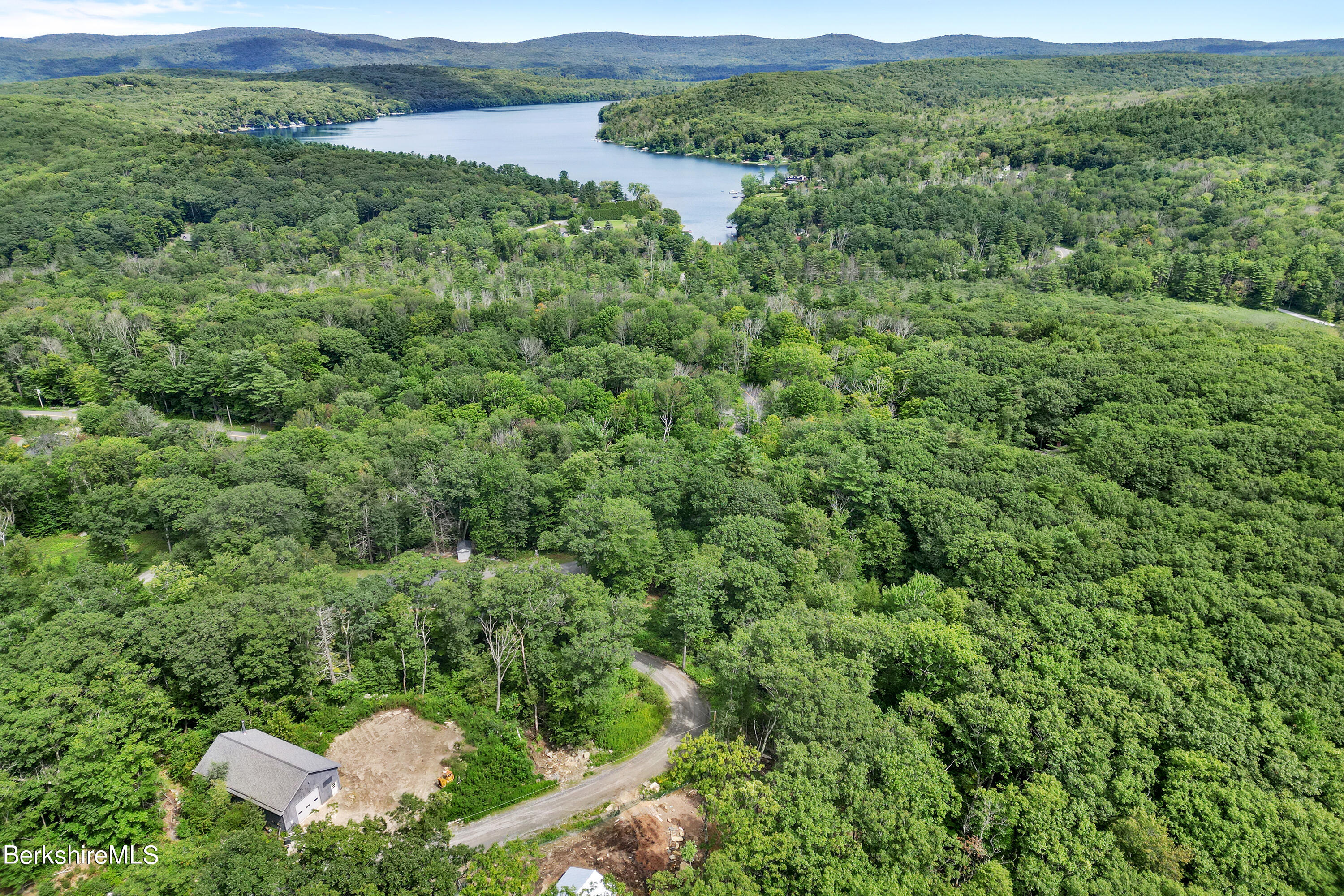 26 A Stonebridge Way Tyringham, MA 01238 - Photo 68 of 74 a view of a lush green field with lots of bushes