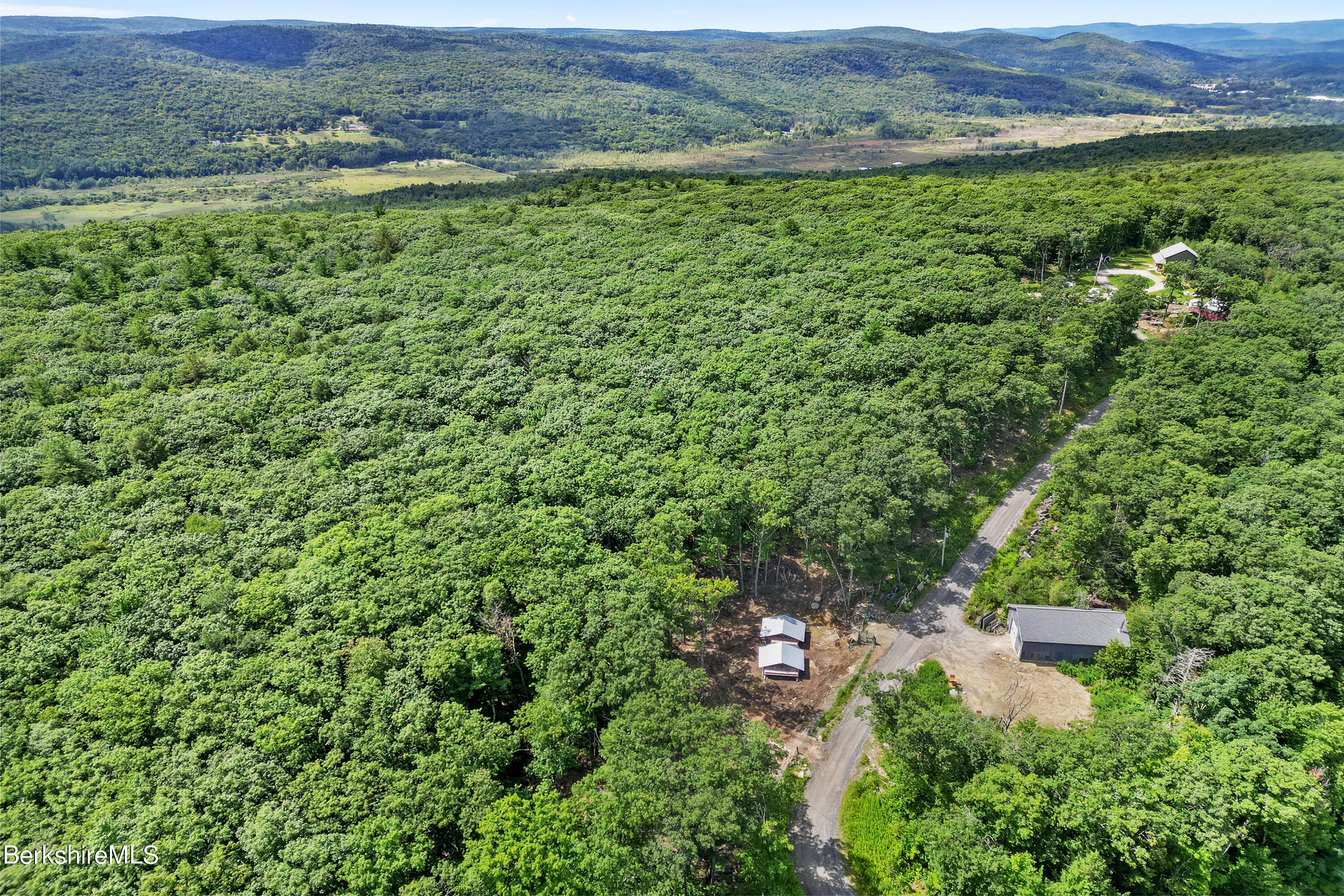 26 A Stonebridge Way Tyringham, MA 01238 - Photo 71 of 74 an aerial view of a house with a yard