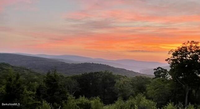 26 A Stonebridge Way Tyringham, MA 01238 - Photo 73 of 74 a view of a city with mountain