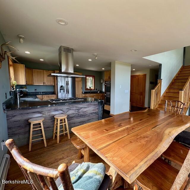 26 A Stonebridge Way Tyringham, MA 01238 - Photo 8 of 74 a kitchen with stainless steel appliances kitchen island granite countertop a table chairs sink and cabinets