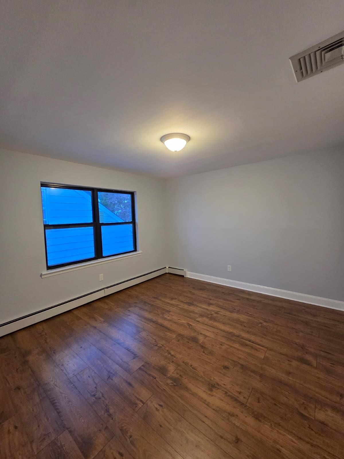 730 5th Street, Unit 2 Carlstadt, NJ 07072 - Photo 14 of 15 a view of empty room with wooden floor