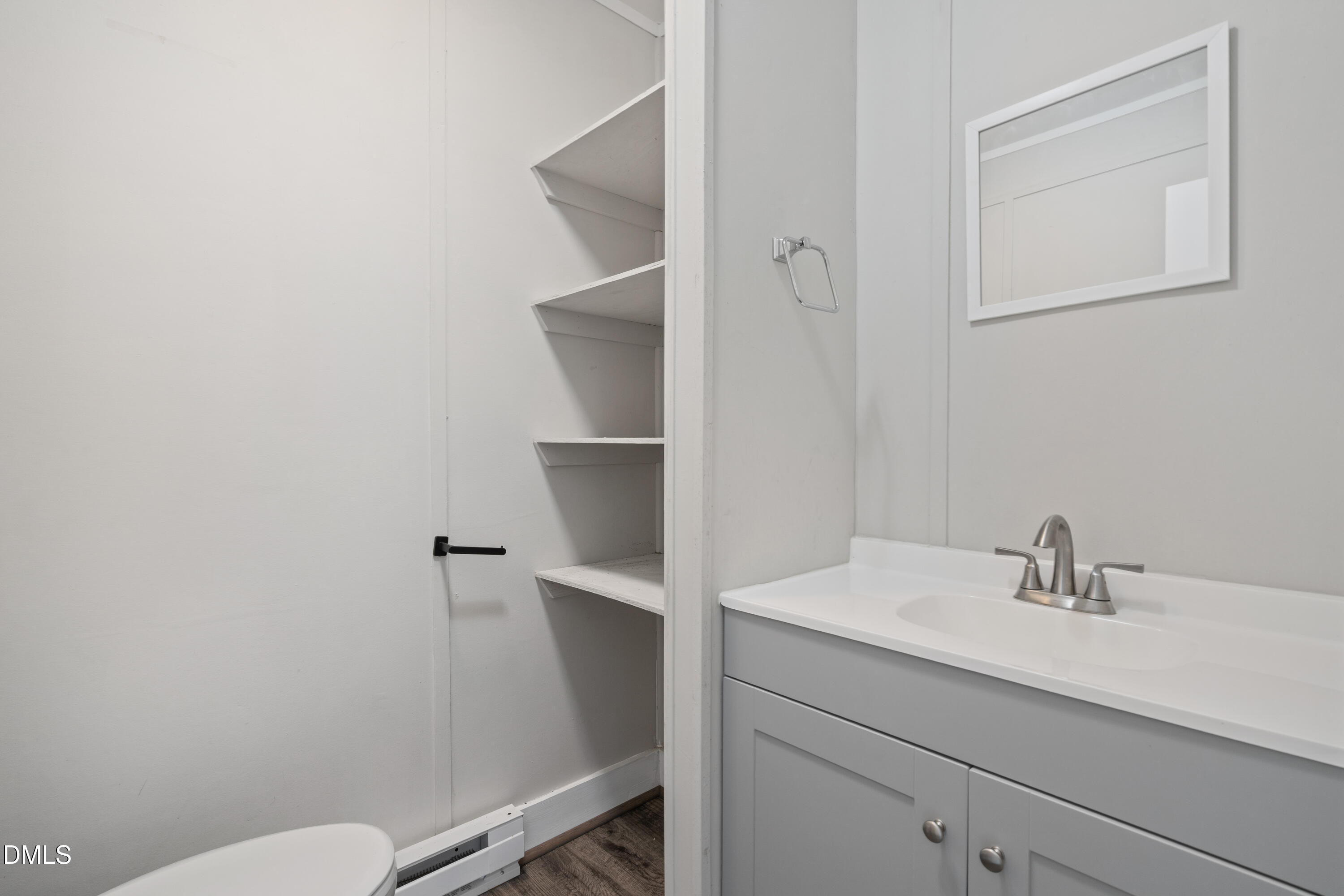 70 Lynnbank Estates Road Kittrell, NC 27544 - Photo 19 of 21 a bathroom with a sink a toilet and a mirror