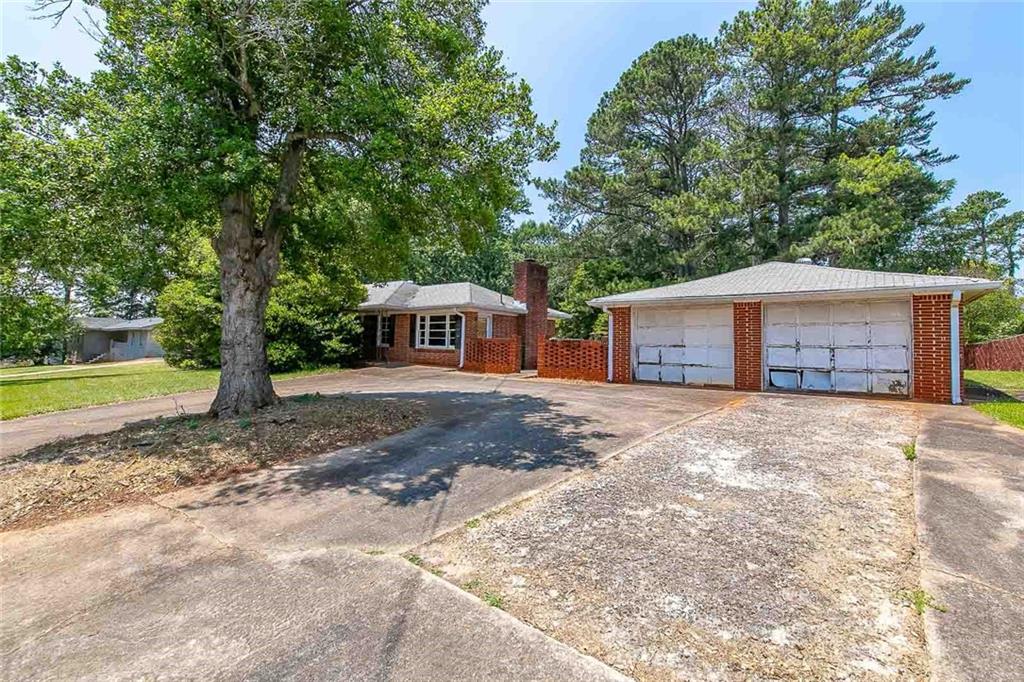 3866 Boring Road Decatur, GA 30034 - Photo 1 of 1 a front view of a house with a yard and garage