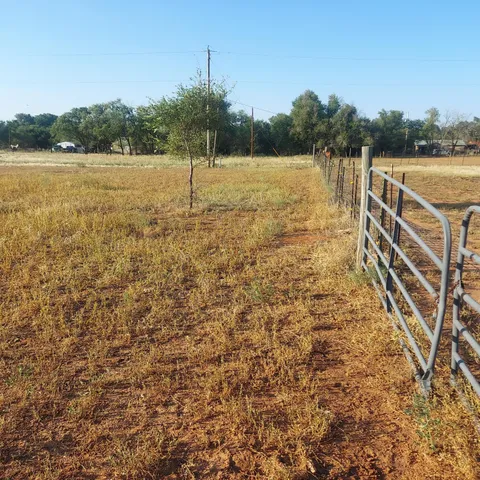 a view of a lake with houses in the back
