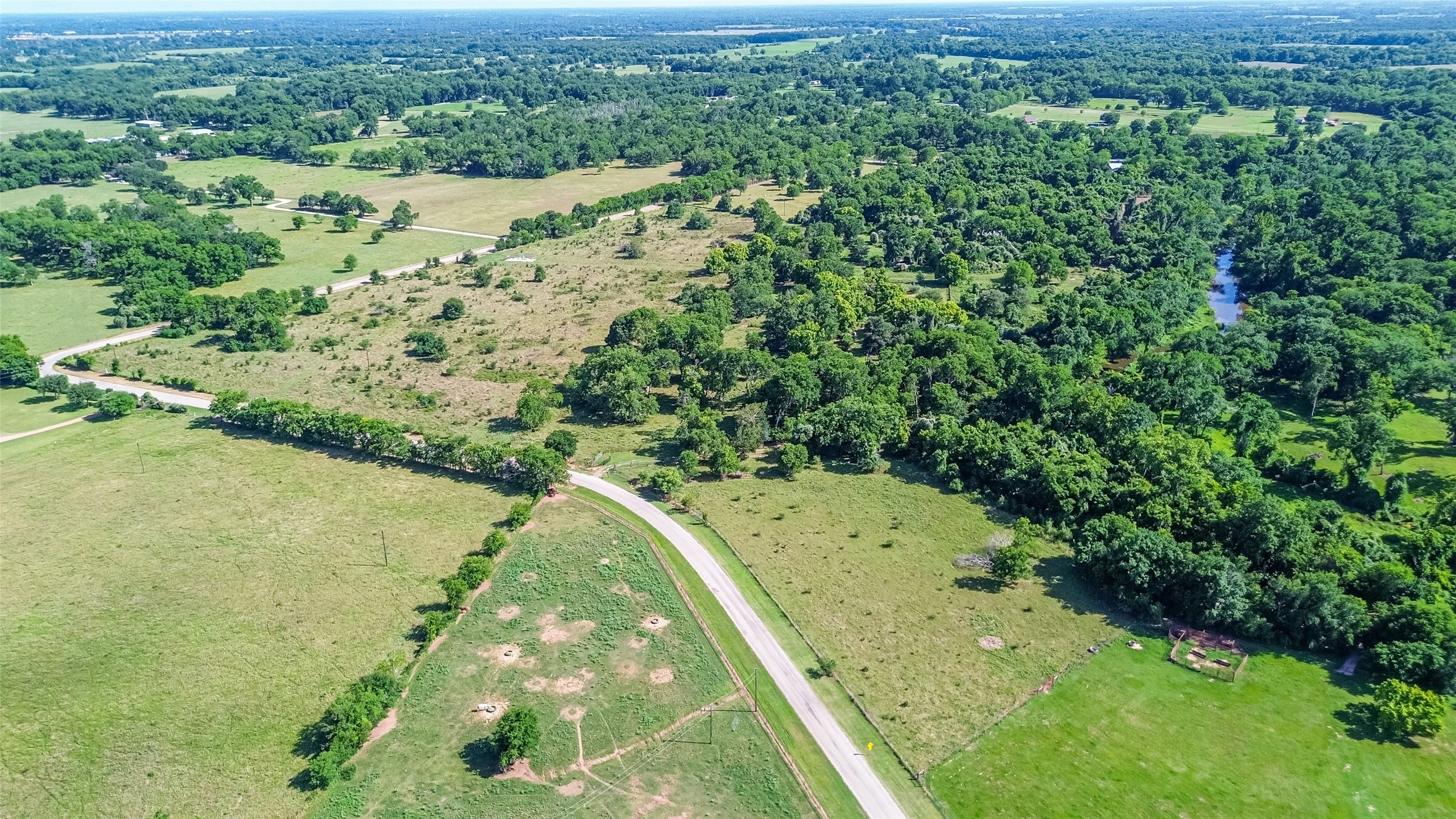 2511 Hartwell Road Brookshire, TX 77423 - Photo 31 of 40 a view of a yard with a tree