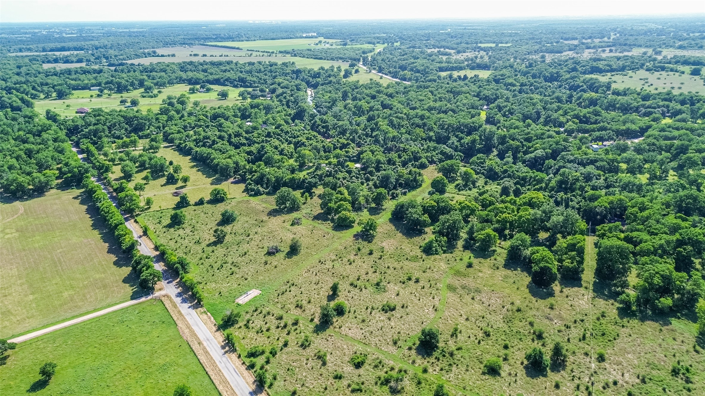 2511 Hartwell Road Brookshire, TX 77423 - Photo 34 of 40 an aerial view of residential houses with outdoor space and trees