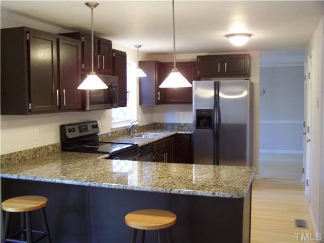 7241 Shellburne Drive Raleigh, NC 27612 - Photo 2 of 4 Granite countertop, stainless appliances.